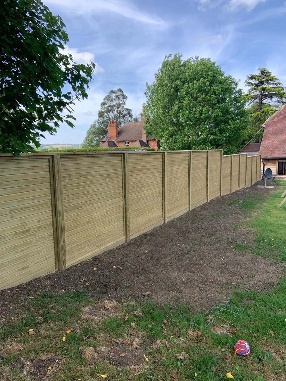 This is a photo of an acoustic fence installed by Fast Fix Fencing Lakenheath