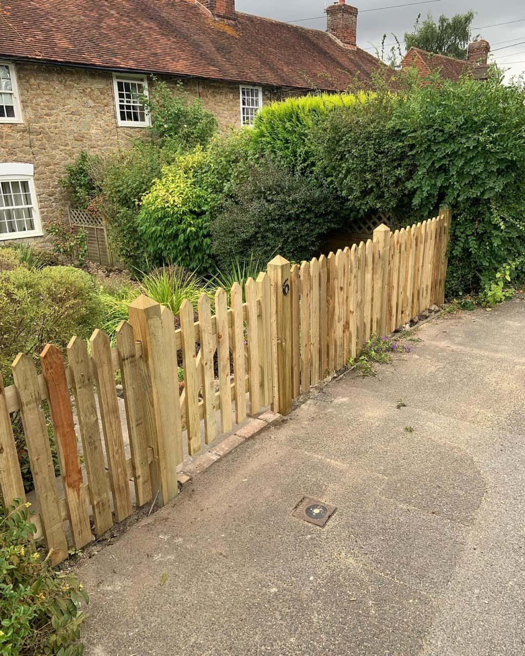 This is a photo of a picket fence and picket gate installed by Fast Fix Fencing Lakenheath